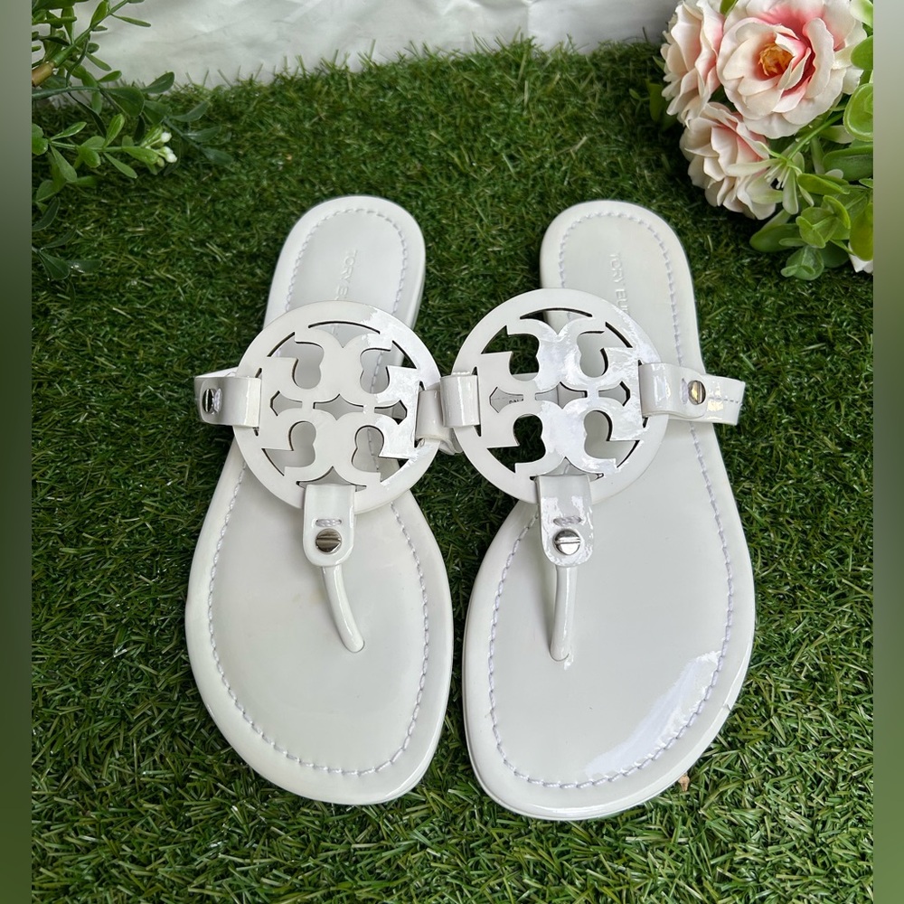 Tory Burch 
Miller cut-out leather flip-flops
$267 Sandals Sz 59 optical white - Picture 10 of 16